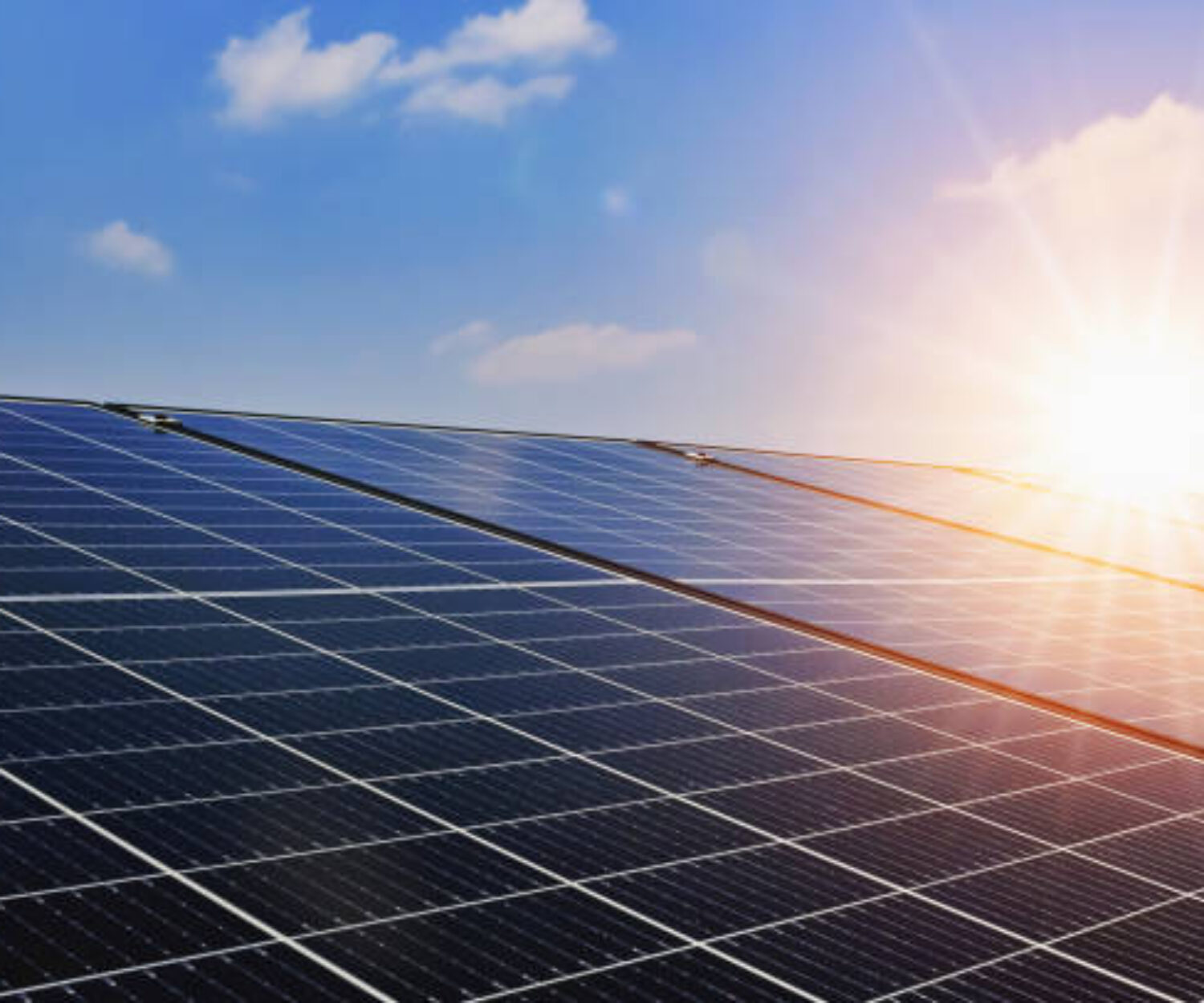 Solar panels with sunset and blue sky background. Clean power energy concept